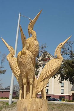 Carved Herons by Dayton Scoggins; photo: ? Gulf Coast News